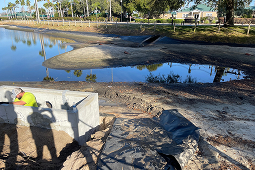 Engineer from Kissimmee Construction Company Working on a Pond Restoration Project